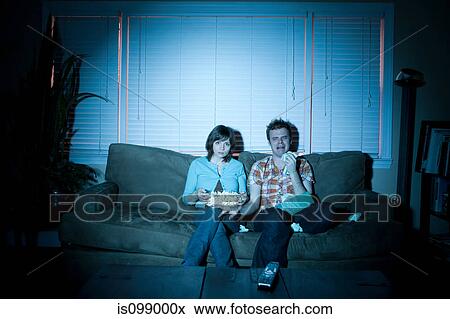 Young couple watching tv, man crying View Large Photo Image Stock Photo - Young couple watching tv, man crying. Fotosearch