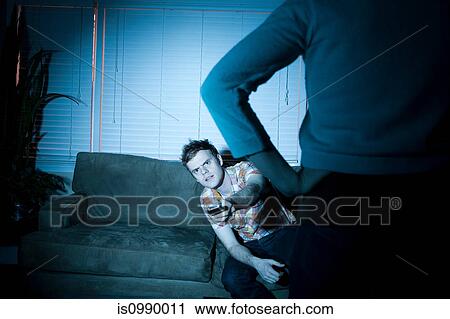 Young man watching tv, woman blocking view View Large Photo Image Stock Image - Young man watching tv, woman blocking view. Fotosearch