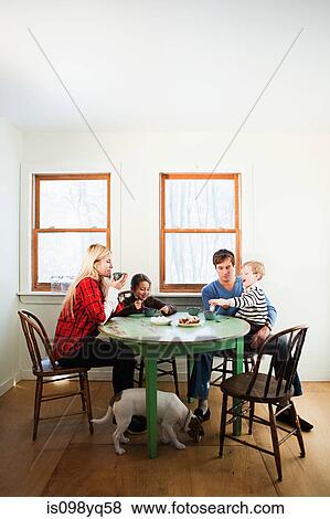 Stock Photo - Family having breakfast. Fotosearch