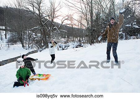 Family having snowball fight View Large Photo Image Stock Photo - Family having snowball fight. Fotosearch