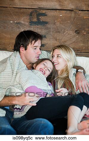 Family on bed View Large Photo Image Stock Image - Family on bed. Fotosearch