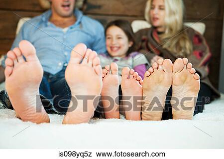 Family on bed with barefeet View Large Photo Image Stock Photo - Family on bed with barefeet. Fotosearch
