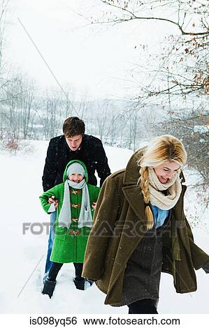 Family walking in snow View Large Photo Image Stock Photograph - Family walking in snow. Fotosearch