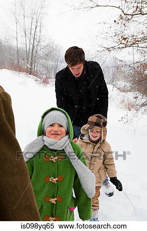 Family walking in snow View Large Photo Image Stock Photography - Family walking in snow. Fotosearch