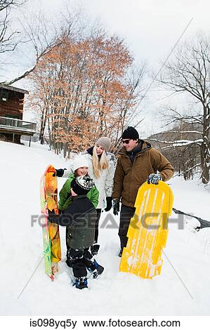 Family with sledges in snow View Large Photo Image Stock Photo - Family with sledges in snow. Fotosearch