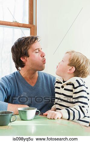 Father and son pulling faces View Large Photo Image Stock Photograph - Father and son pulling faces. Fotosearch