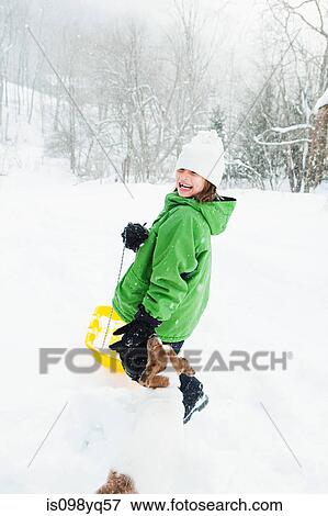 Girl sledging in snow View Large Photo Image Stock Photo - Girl sledging in snow. Fotosearch