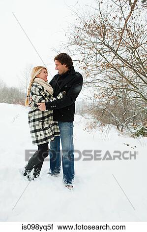 Mid adult couple in snow View Large Photo Image Stock Image - Mid adult couple in snow. Fotosearch