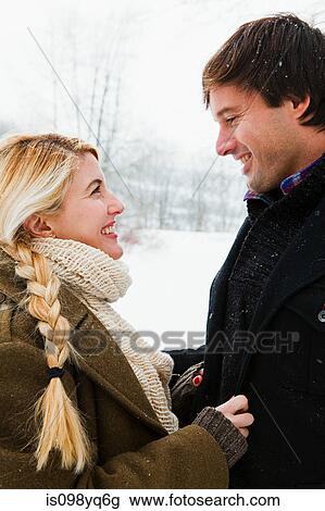 Mid adult couple in snow View Large Photo Image Stock Image - Mid adult couple in snow. Fotosearch
