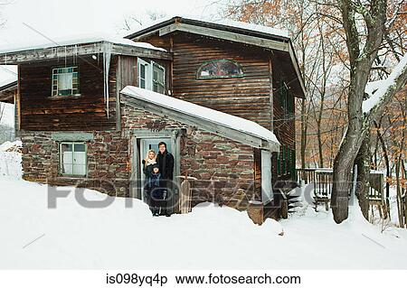 Portrait of family outside rustic house View Large Photo Image Stock Photography - Portrait of family outside rustic house. Fotosearch