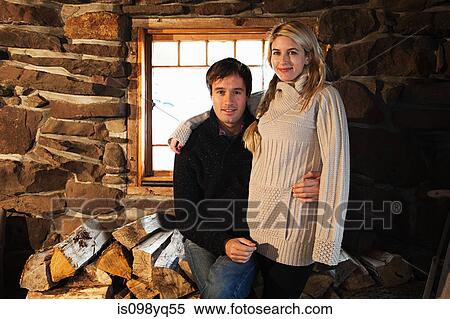 Portrait of mid adult couple in rustic house View Large Photo Image Stock Photography - Portrait of mid adult couple in rustic house. Fotosearch