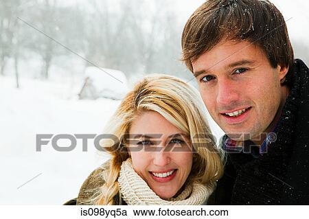 Portrait of mid adult couple in snow View Large Photo Image Stock Image - Portrait of mid adult couple in snow. Fotosearch