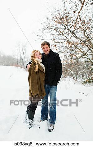 Portrait of mid adult couple in snow View Large Photo Image Stock Image - Portrait of mid adult couple in snow. Fotosearch