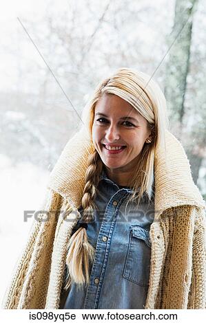 Portrait of mid adult woman wearing cardigan View Large Photo Image Stock Image - Portrait of mid adult woman wearing cardigan. Fotosearch