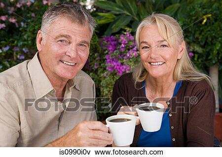 Mature couple having coffee View Large Photo Image Stock Photo - Mature couple having coffee. Fotosearch
