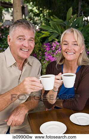 Mature couple having coffee View Large Photo Image Stock Photo - Mature couple having coffee. Fotosearch