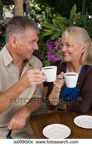 Mature couple having coffee View Large Photo Image Stock Photo - Mature couple having coffee. Fotosearch