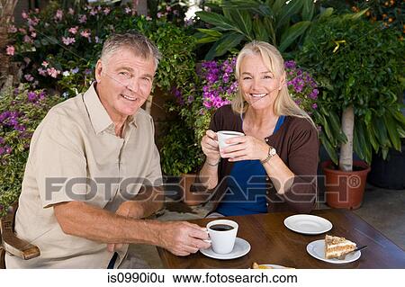 Mature couple having coffee View Large Photo Image Stock Photograph - Mature couple having coffee. Fotosearch