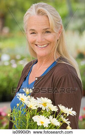 Woman with flowers View Large Photo Image Stock Image - Woman with flowers. Fotosearch