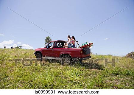 Stock Image - Off road vehicle driving towards beach. Fotosearch