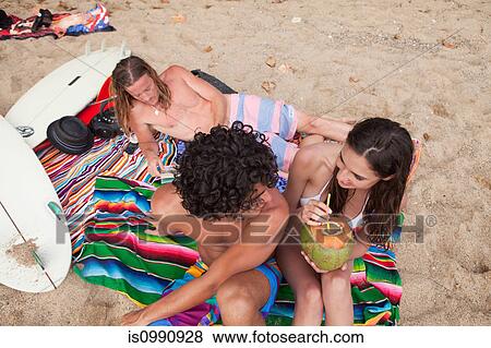 Three young friends on beach vacation View Large Photo Image Stock Photo - Three young friends on beach vacation. Fotosearch