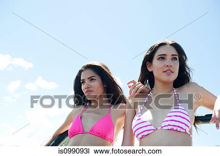 Two young women on vacation, portrait View Large Photo Image Stock Image - Two young women on vacation, portrait. Fotosearch