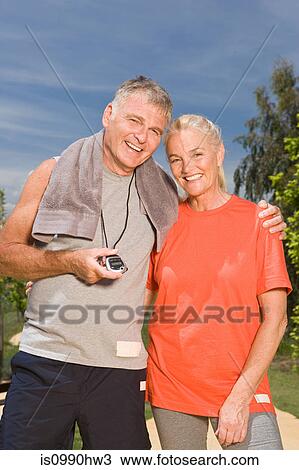 Stock Image - Mature couple after workout. Fotosearch