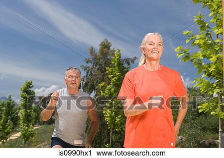 Mature couple jogging View Large Photo Image Stock Image - Mature couple jogging. Fotosearch