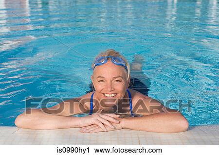 Mature woman in swimming pool View Large Photo Image Stock Image - Mature woman in swimming pool. Fotosearch