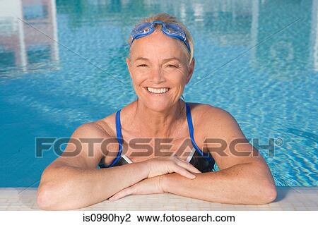 Stock Image - Mature woman in swimming pool. Fotosearch