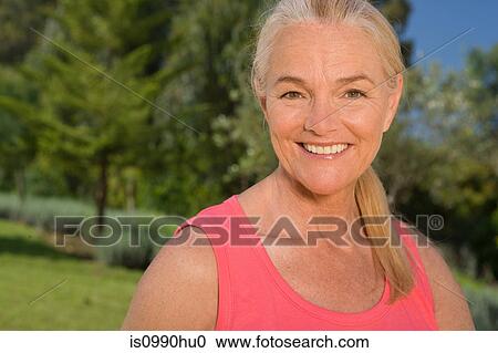 Mature woman outdoors View Large Photo Image Stock Image - Mature woman outdoors. Fotosearch