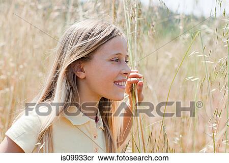 Blonde girl in field, portrait View Large Photo Image Stock Photography - Blonde girl in field, portrait. Fotosearch
