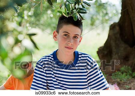 Boy wearing striped t shirt, portrait View Large Photo Image Stock Photograph - Boy wearing striped t shirt, portrait. Fotosearch