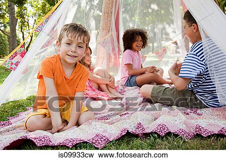 Four friends in summer netting tent View Large Photo Image Stock Photo - Four friends in summer netting tent. Fotosearch