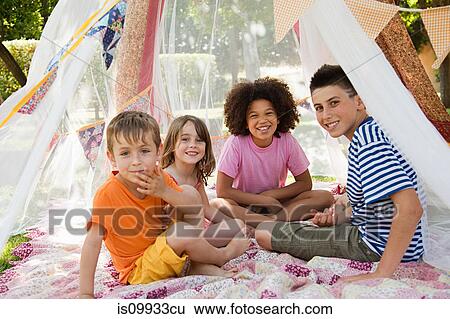 Four friends in summer netting tent View Large Photo Image Stock Photograph - Four friends in summer netting tent. Fotosearch
