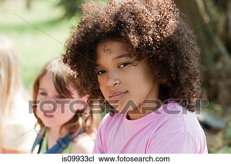 Pensive girl looking at camera, portrait View Large Photo Image Stock Image - Pensive girl looking at camera, portrait. Fotosearch