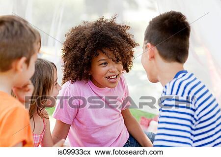 Three friends in summer netting tent View Large Photo Image Stock Photo - Three friends in summer netting tent. Fotosearch