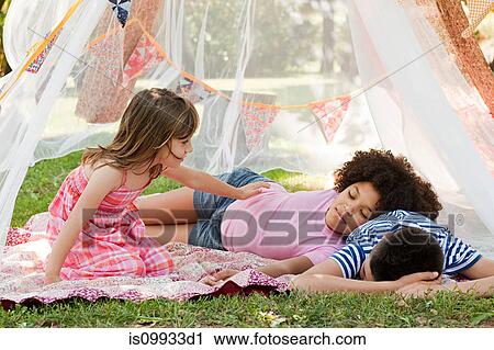 Three friends sleeping in summer netting tent View Large Photo Image Stock Image - Three friends sleeping in summer netting tent. Fotosearch