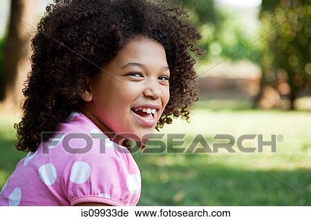 Young girl wearing pink spotty top, portrait View Large Photo Image Stock Image - Young girl wearing pink spotty top, portrait. Fotosearch