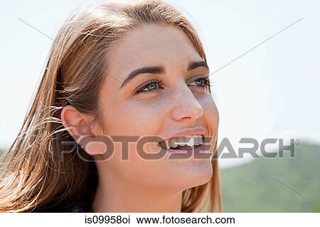Close up portrait of blonde haired young woman View Large Photo Image Stock Image - Close up portrait of blonde haired young woman. Fotosearch