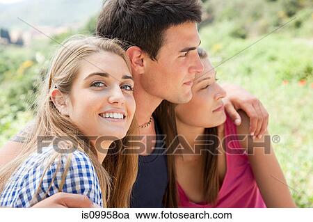 Three young friends, portrait View Large Photo Image Stock Image - Three young friends, portrait. Fotosearch