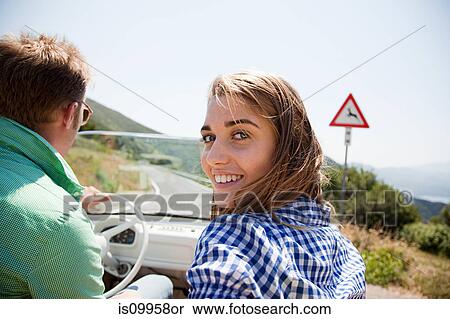 Young couple in convertible car View Large Photo Image Stock Photography - Young couple in convertible car. Fotosearch