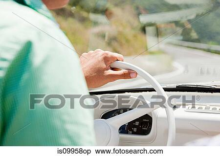 Stock Photography - Young man driving convertible car, close up. Fotosearch