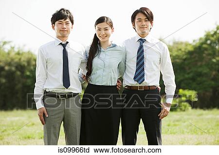 Stock Image - Businessmen and businesswoman, portrait. Fotosearch