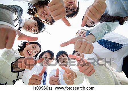 Businesspeople in a circle with thumbs up View Large Photo Image Stock Photo - Businesspeople in a circle with thumbs up. Fotosearch