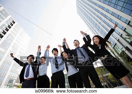 Businesspeople in a row, arms in air View Large Photo Image Stock Image - Businesspeople in a row, arms in air. Fotosearch
