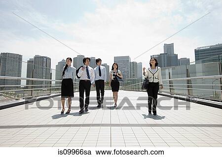 Businesspeople in city scene View Large Photo Image Stock Image - Businesspeople in city scene. Fotosearch