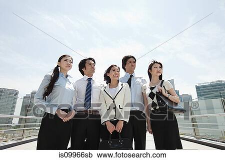 Businesspeople in city scene View Large Photo Image Stock Image - Businesspeople in city scene. Fotosearch