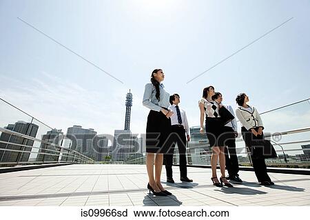 Businesspeople in city scene View Large Photo Image Stock Image - Businesspeople in city scene. Fotosearch