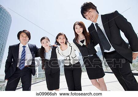 Stock Image - Businesspeople with arms around each other. Fotosearch